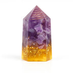 Amethyst and gold crystal tower on a white background