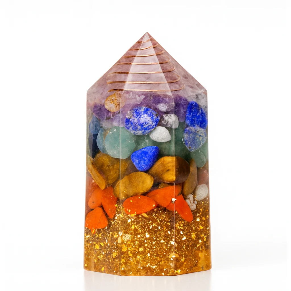 Crystal tower with multicolored stones and glittery base on a white background