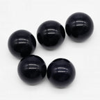 Five black beads on a white background
