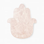 Pink marbled Hamsa hand-shaped object on a white background