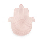 Pink Hamsa hand-shaped dish on a white background