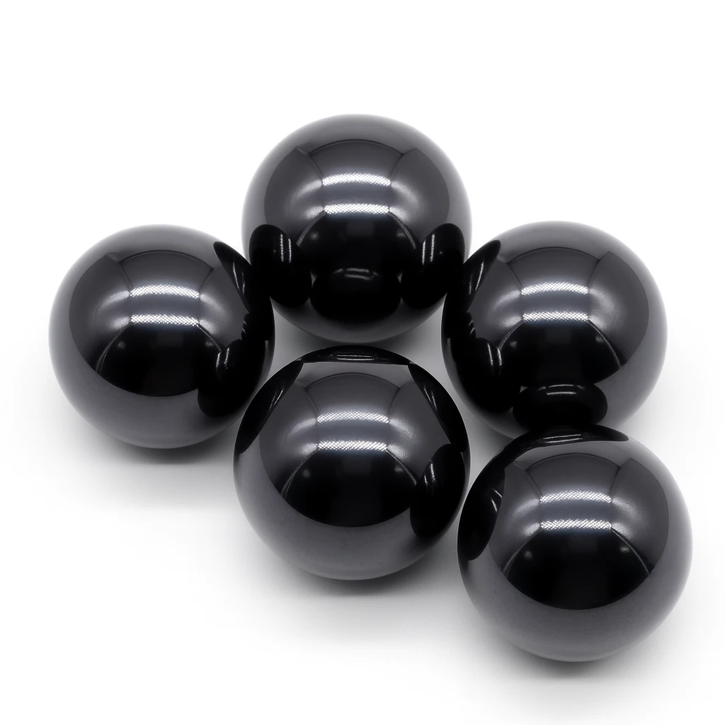 Five glossy black spheres on a white background
