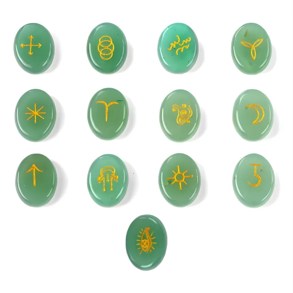 Set of green stones with yellow symbols on a white background