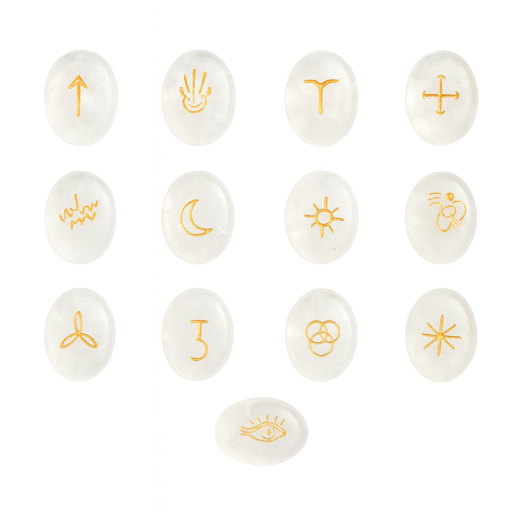 Set of white stones with gold symbols on a white background