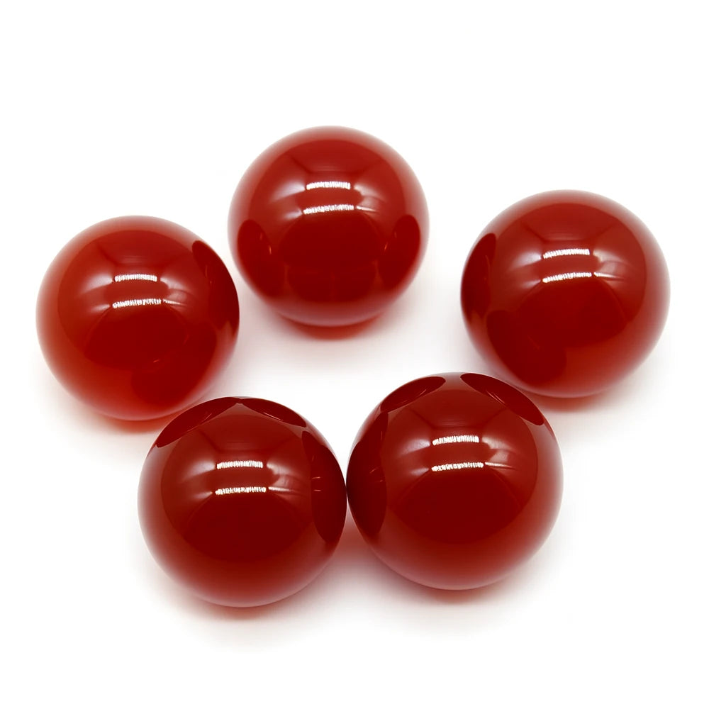 Five red marbles on a white background