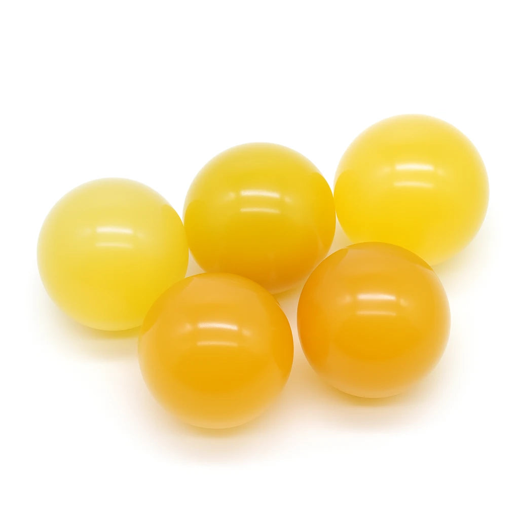 Yellow crystal balls on a white background