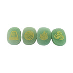 Four green stones with gold symbols on a white background
