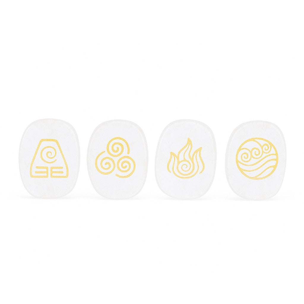 Four white stones with gold symbols on a white background