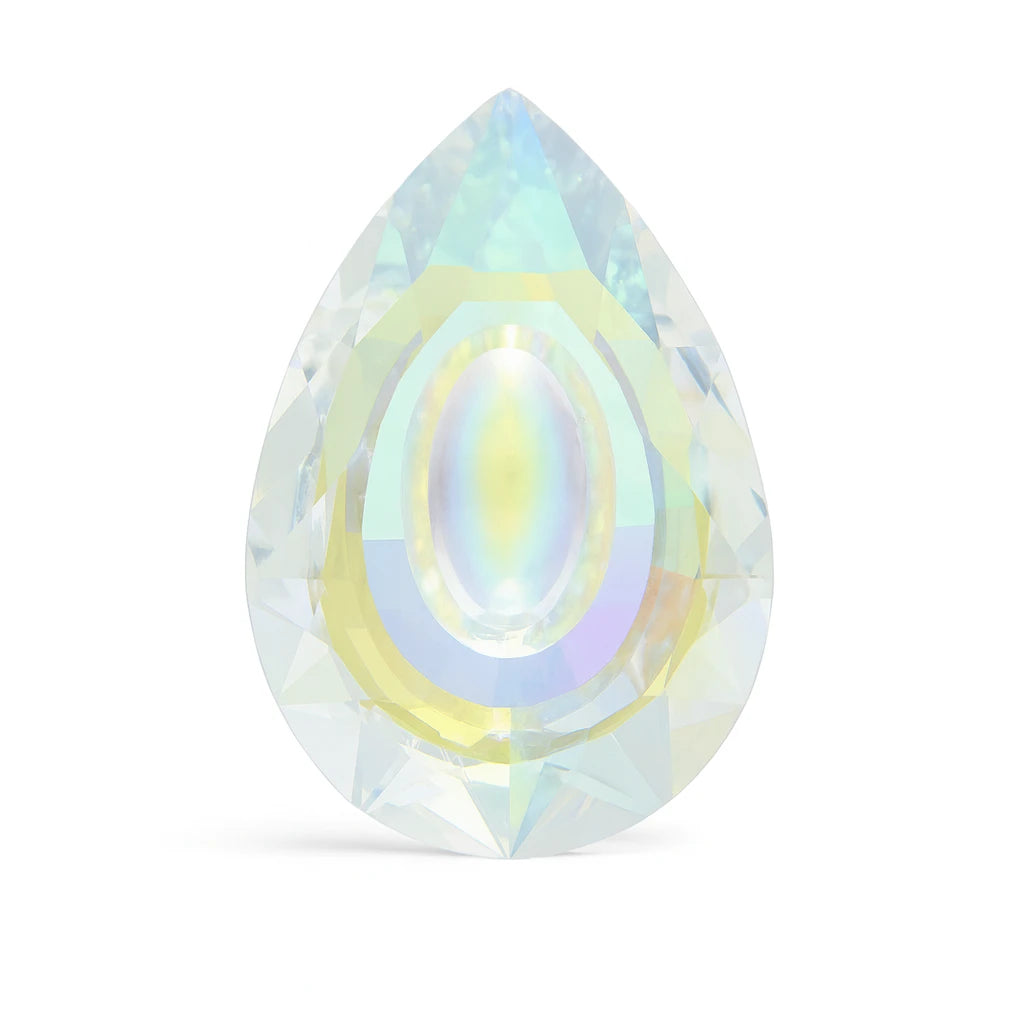 Teardrop-shaped crystal with iridescent colors on a white background