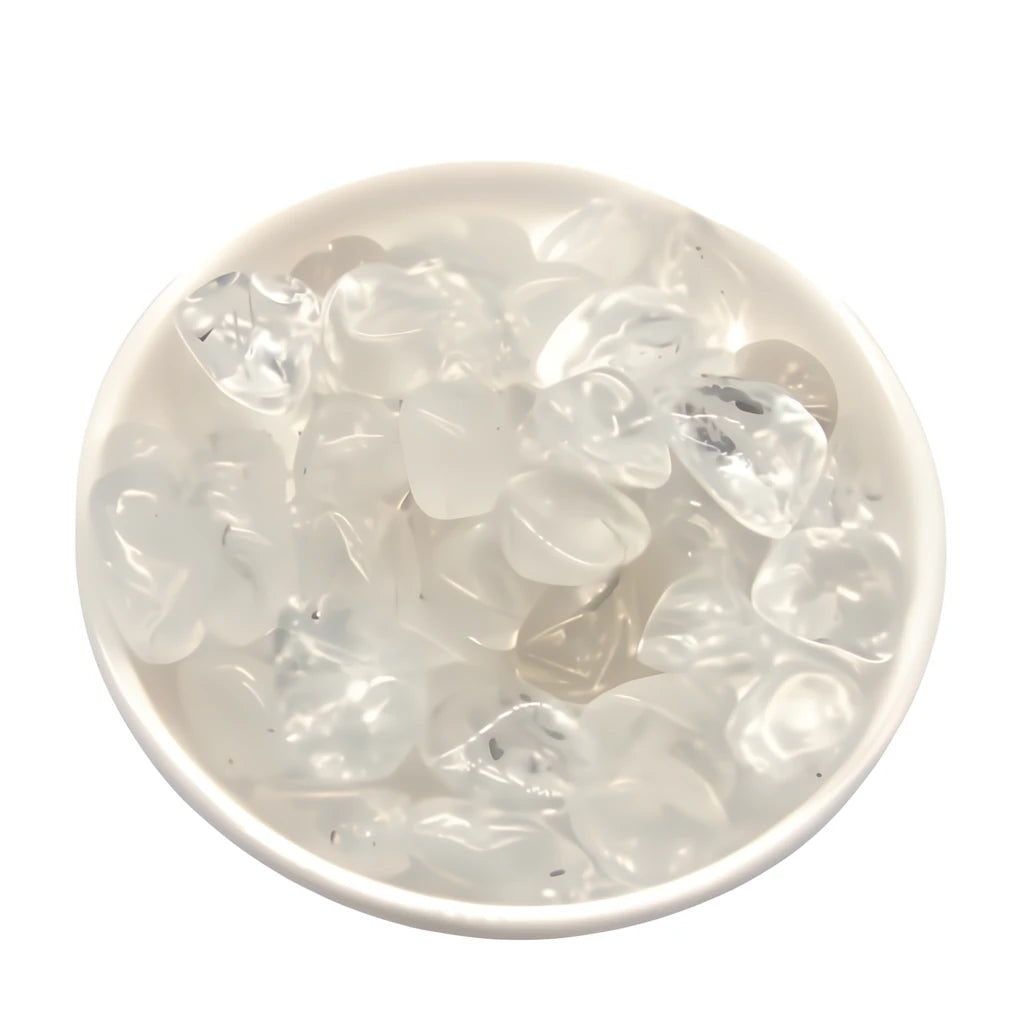 Clear stone chips in a white bowl on a white background