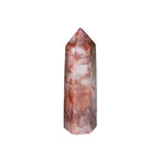 Crystal tower with pink and white marbled pattern on a white background