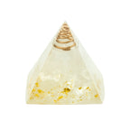Triangular crystal with gold spiral, white stones on a white background