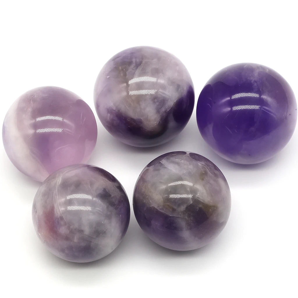 Five purple and gray marbles on a white background