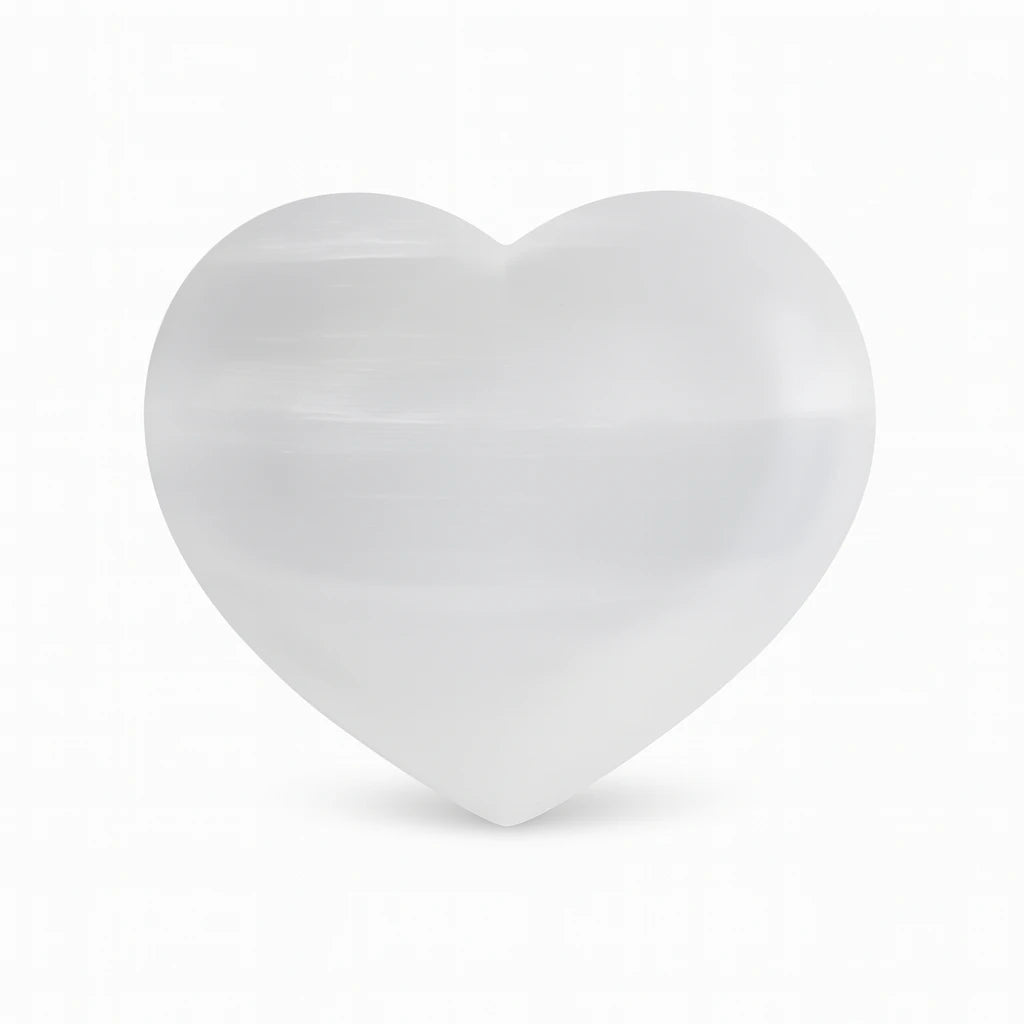 Heart-shaped white crystal on a white background