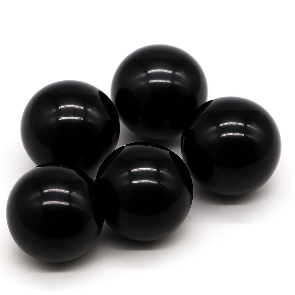 Five black spheres on a white background