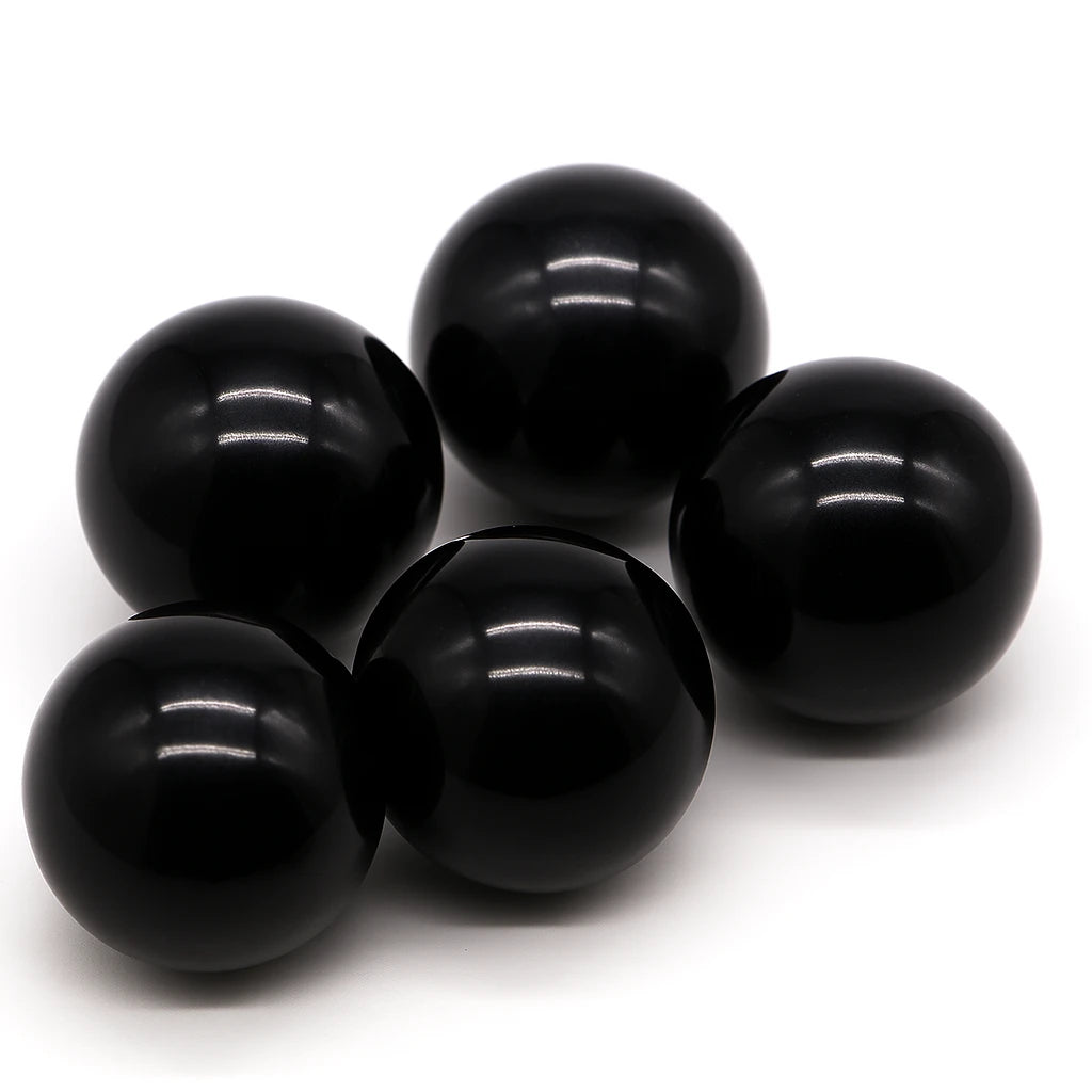 Five black spheres on a white background