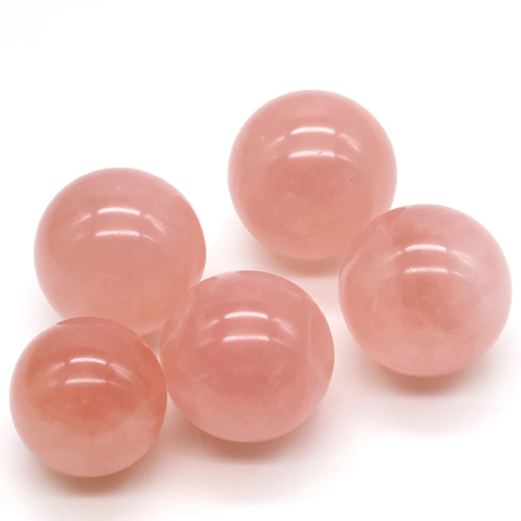 Five pink gemstones on a white background