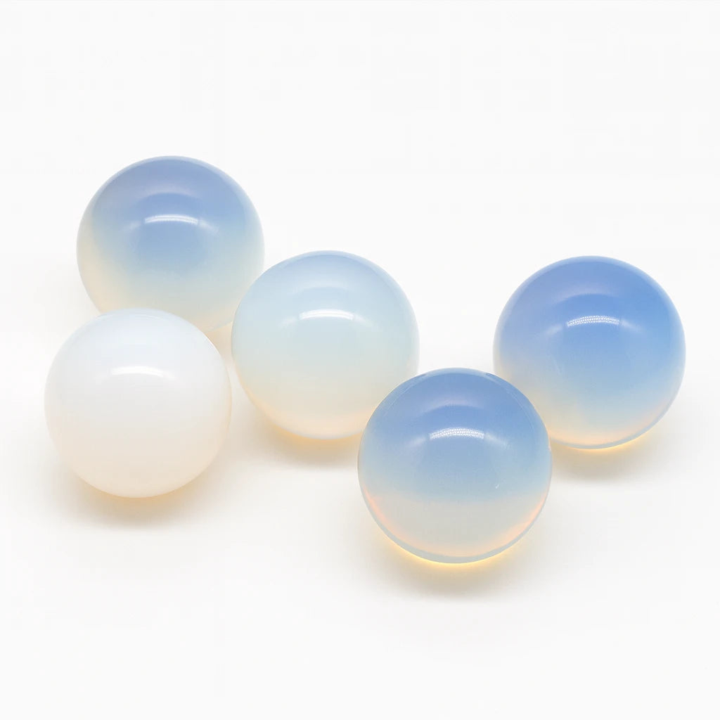 Five gradient beads transitioning from white to blue on a white background