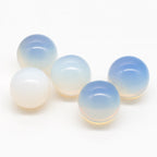 Five gradient beads transitioning from white to blue on a white background