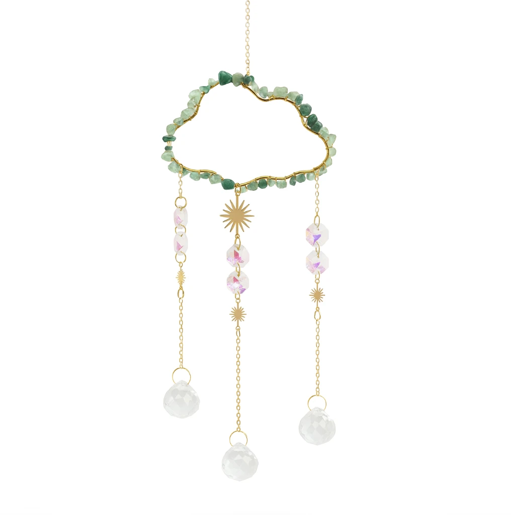 Dreamcatcher with green beads, gold accents, and white pearls on a white background