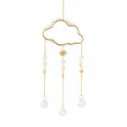 Decorative cloud hanging with pearl-like beads and gold accents on a white background