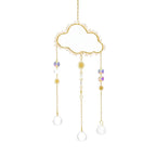 Decorative cloud-shaped hanging ornament with beads and pearls on a white background