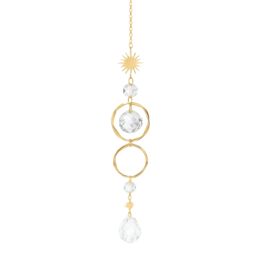 Decorative hanging chain with gold loops and clear crystals on a white background