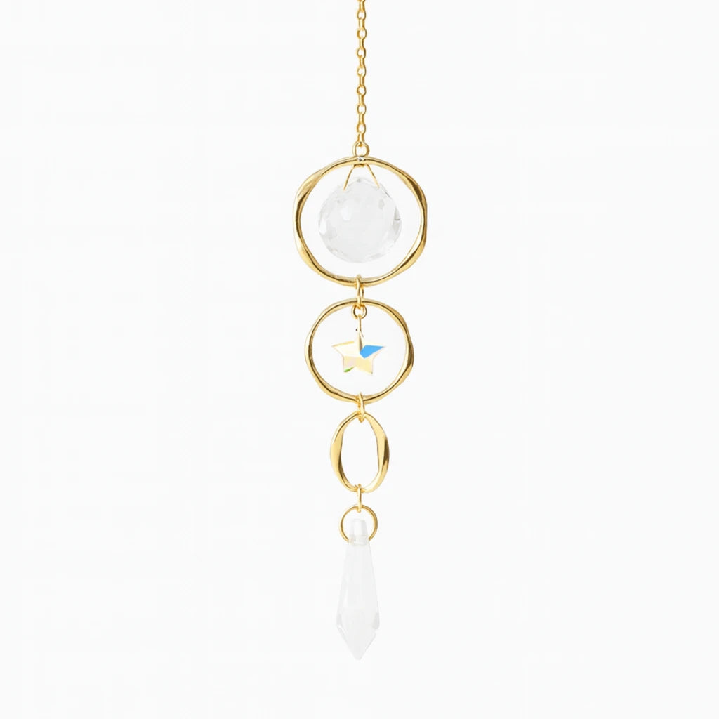 Decorative hanging crystal with gold accents on a white background