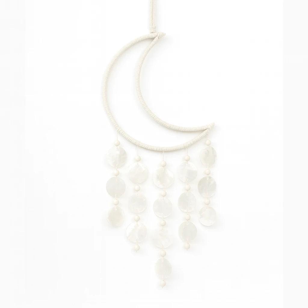 White dramcatcher with a moon pendant on a white background