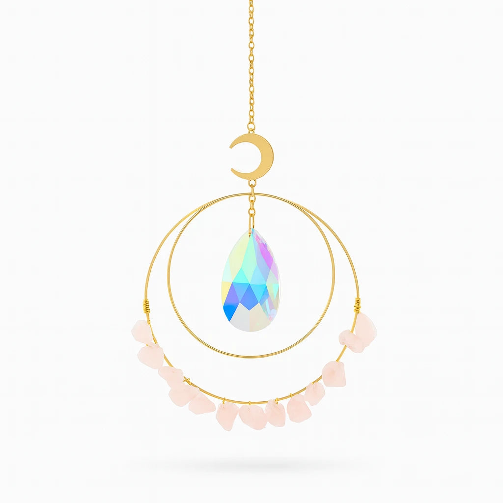 Decorative hanging ornament with a colorful teardrop-shaped crystal, gold chain, and pink stones on a white background.