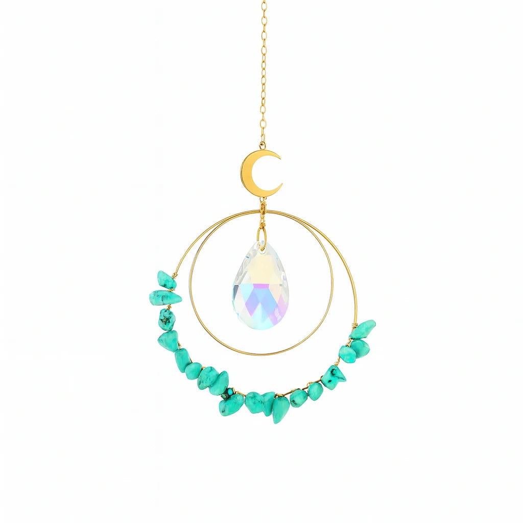 Decorative hanging ornament with turquoise stones and a crystal, on a white background