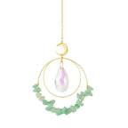 Jewelry with a teardrop-shaped gemstone and green beads on a white background