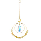 Decorative hanging ornament with gold chain, circular design, and iridescent teardrop pendant on a white background.