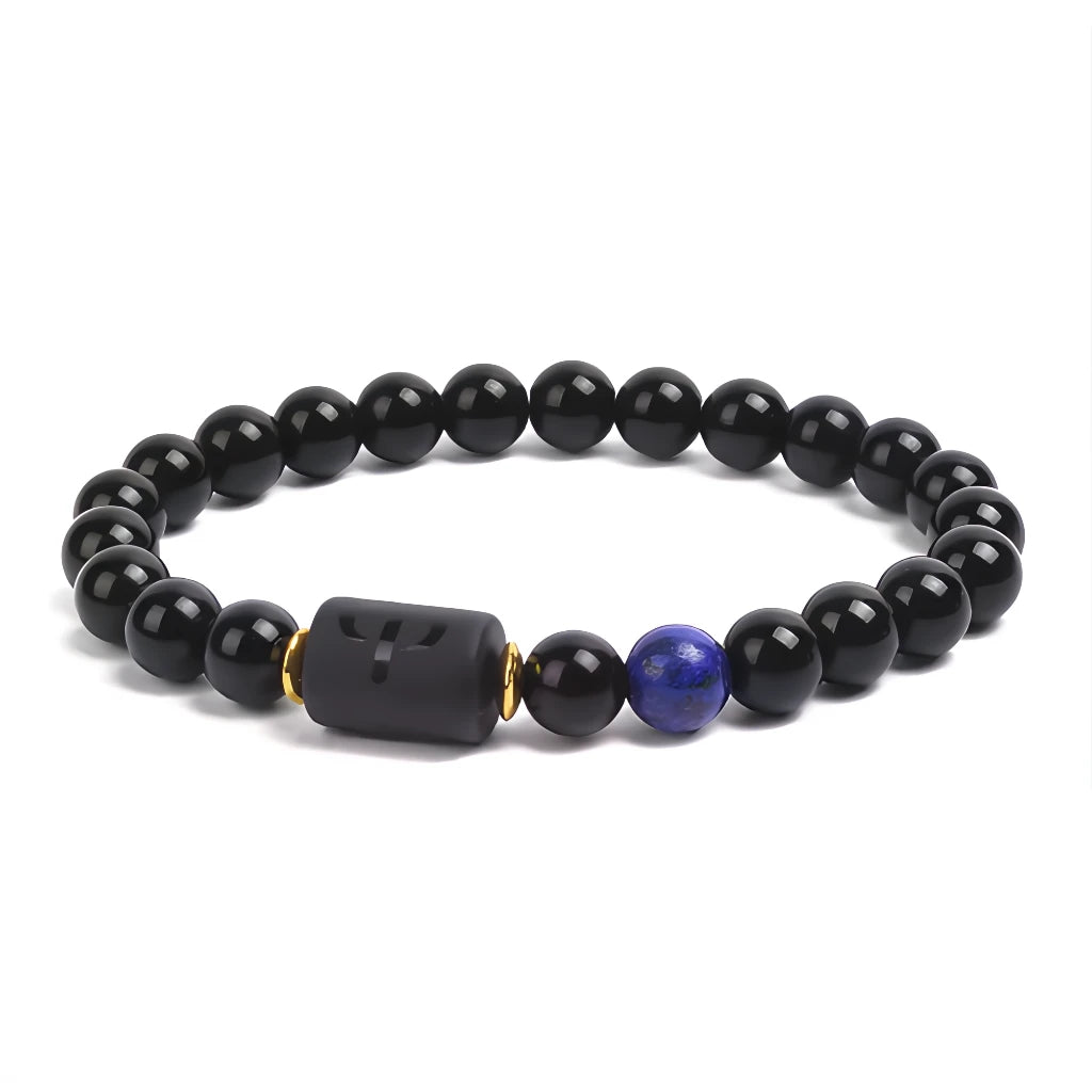 Black beaded bracelet with a blue and gold accent bead on a white background