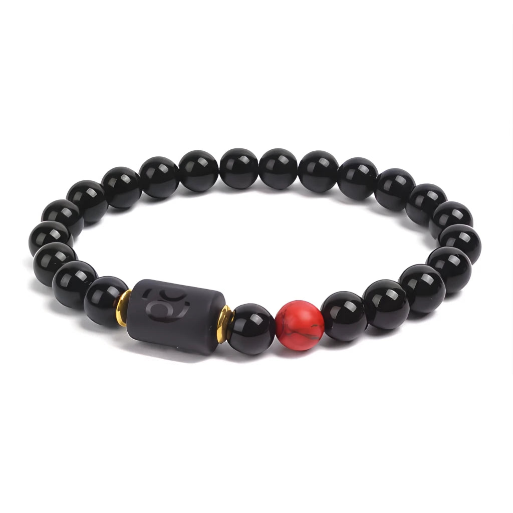 Black beaded bracelet with a red accent bead on a white background
