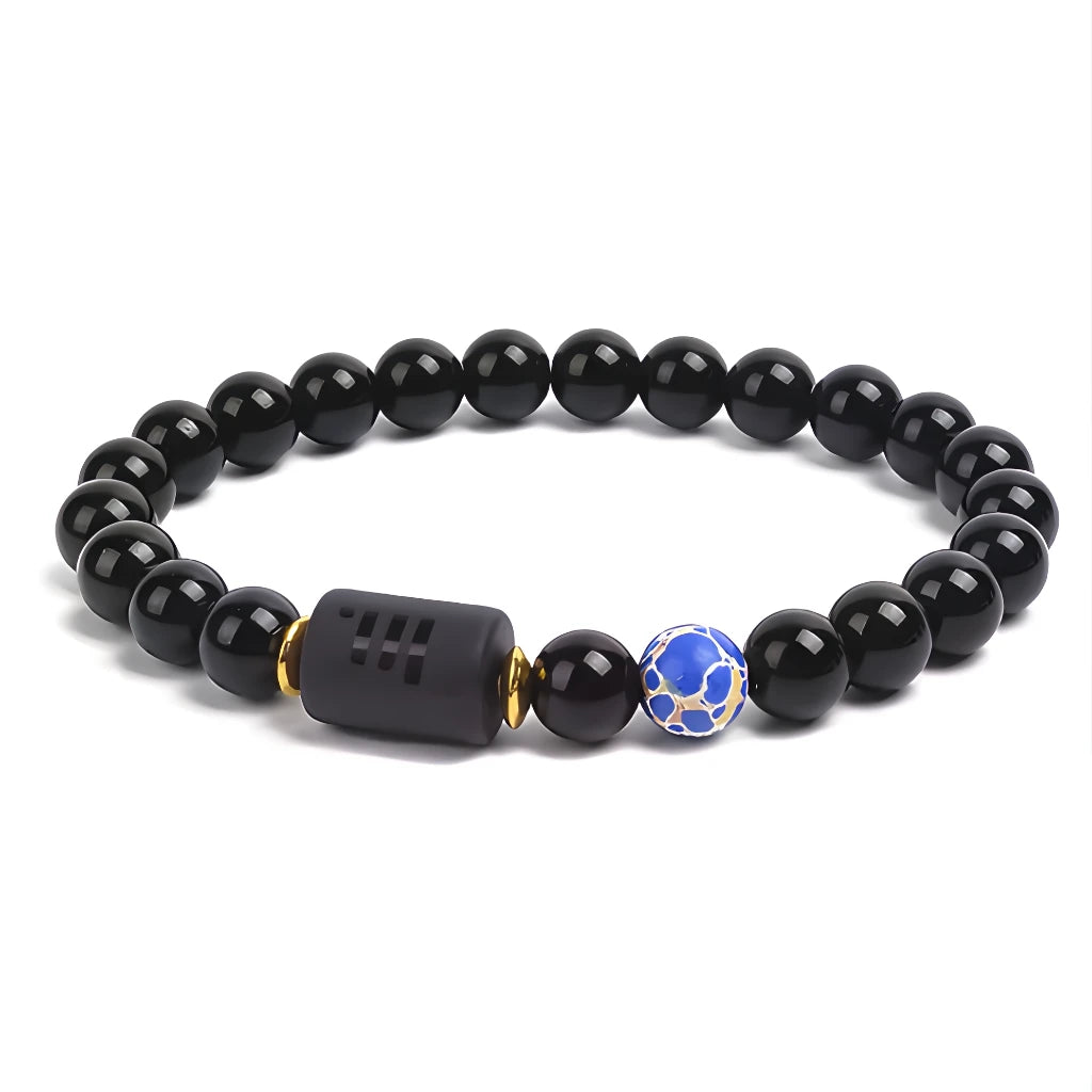 Black beaded bracelet with a blue and gold accent bead on a white background