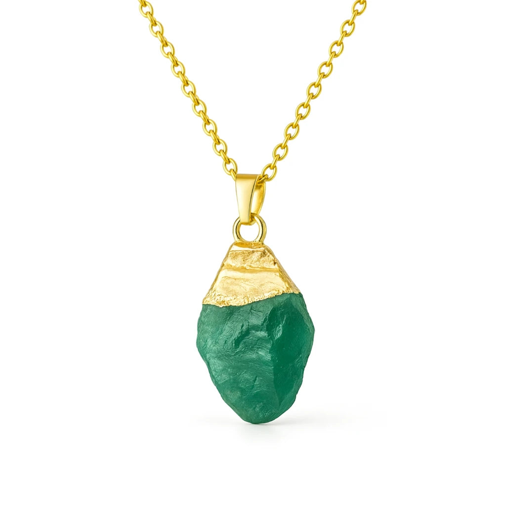 Gold necklace with a green pendant on a white background