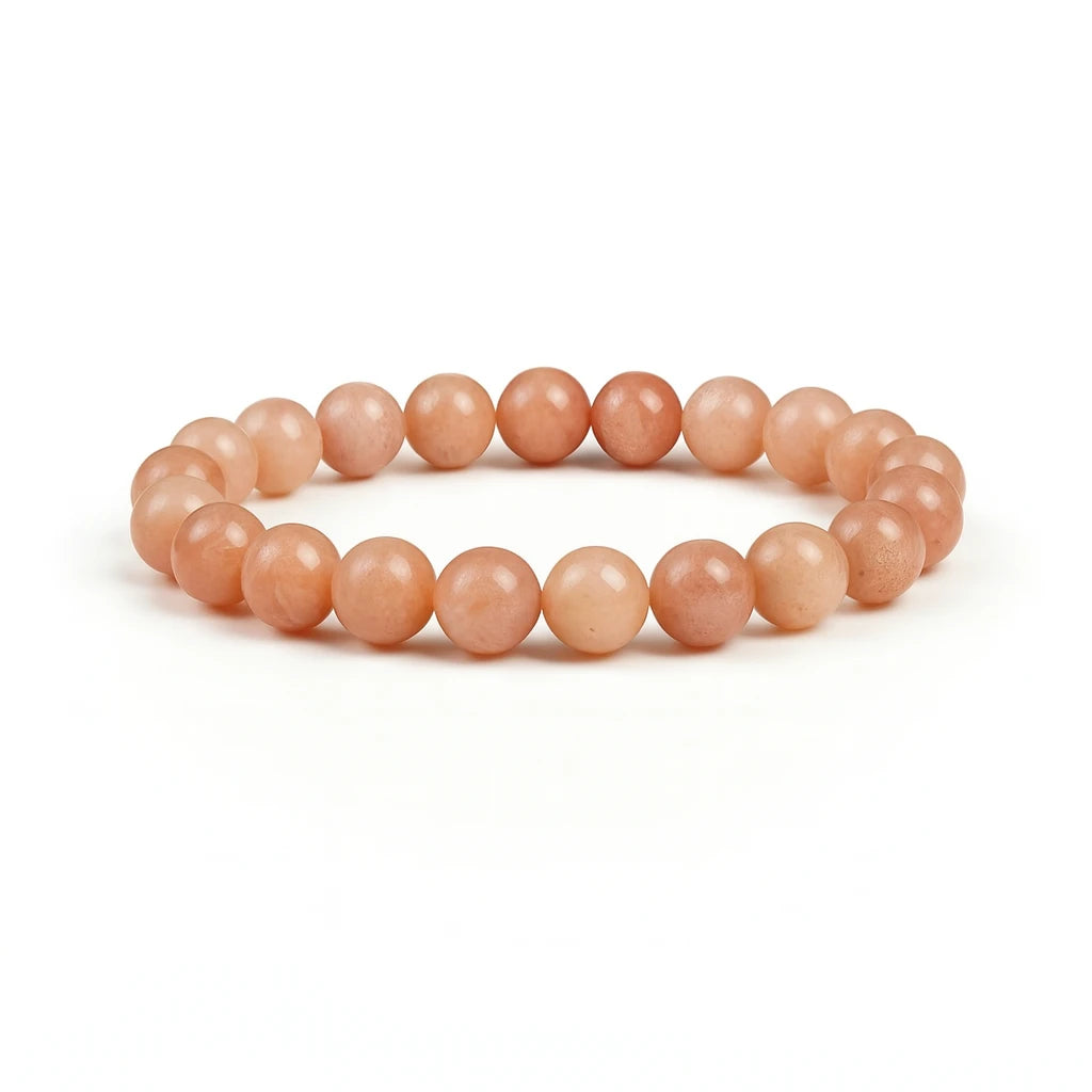 Orange beaded bracelet on a white background