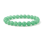 Green beaded bracelet on a white background