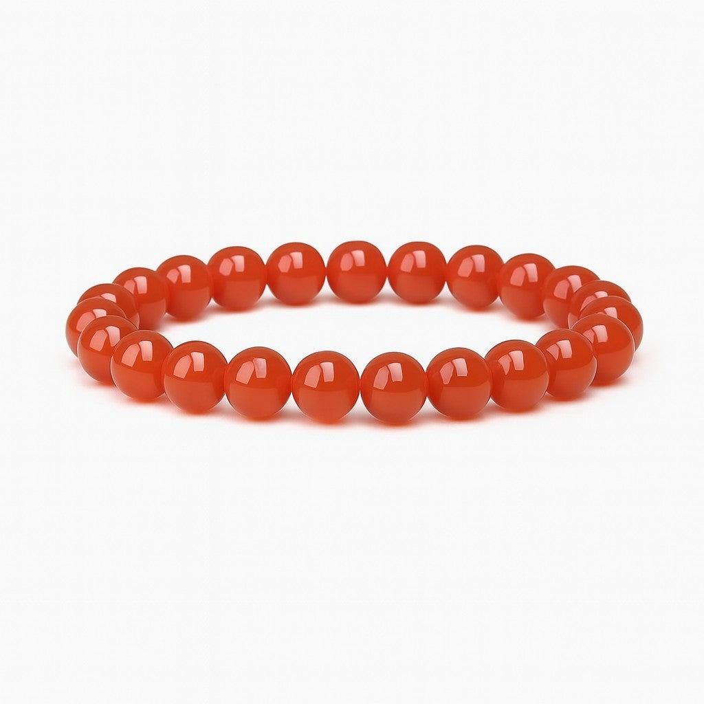 Red beaded bracelet on a white background