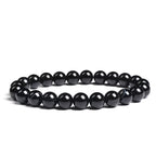 Black beaded bracelet on a white background