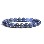 Blue beaded bracelet on a white background