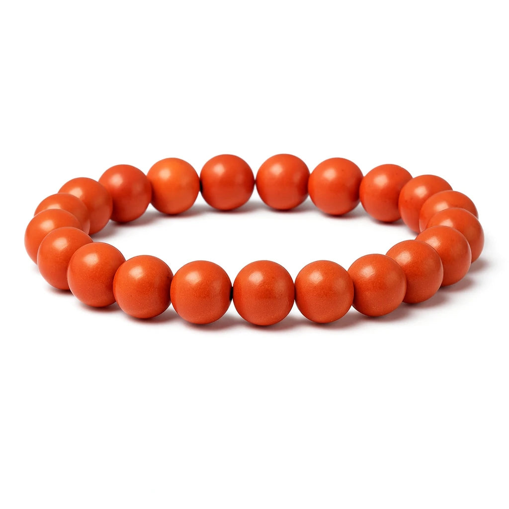 Orange beaded bracelet on a white background