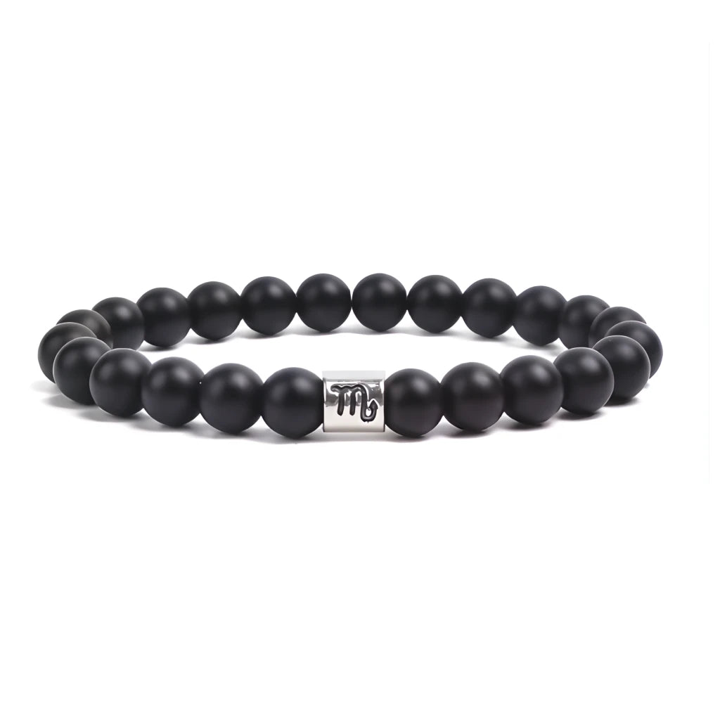 Black beaded bracelet with a metal tag on a white background