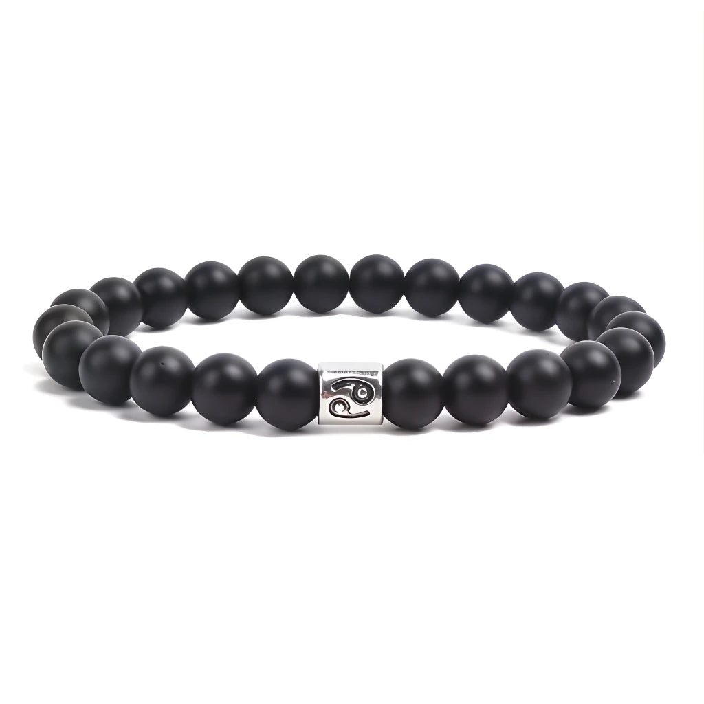 Black beaded bracelet with a silver clasp on a white background