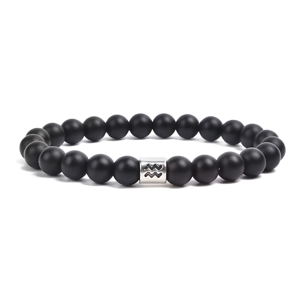 Black beaded bracelet with a silver clasp on a white background