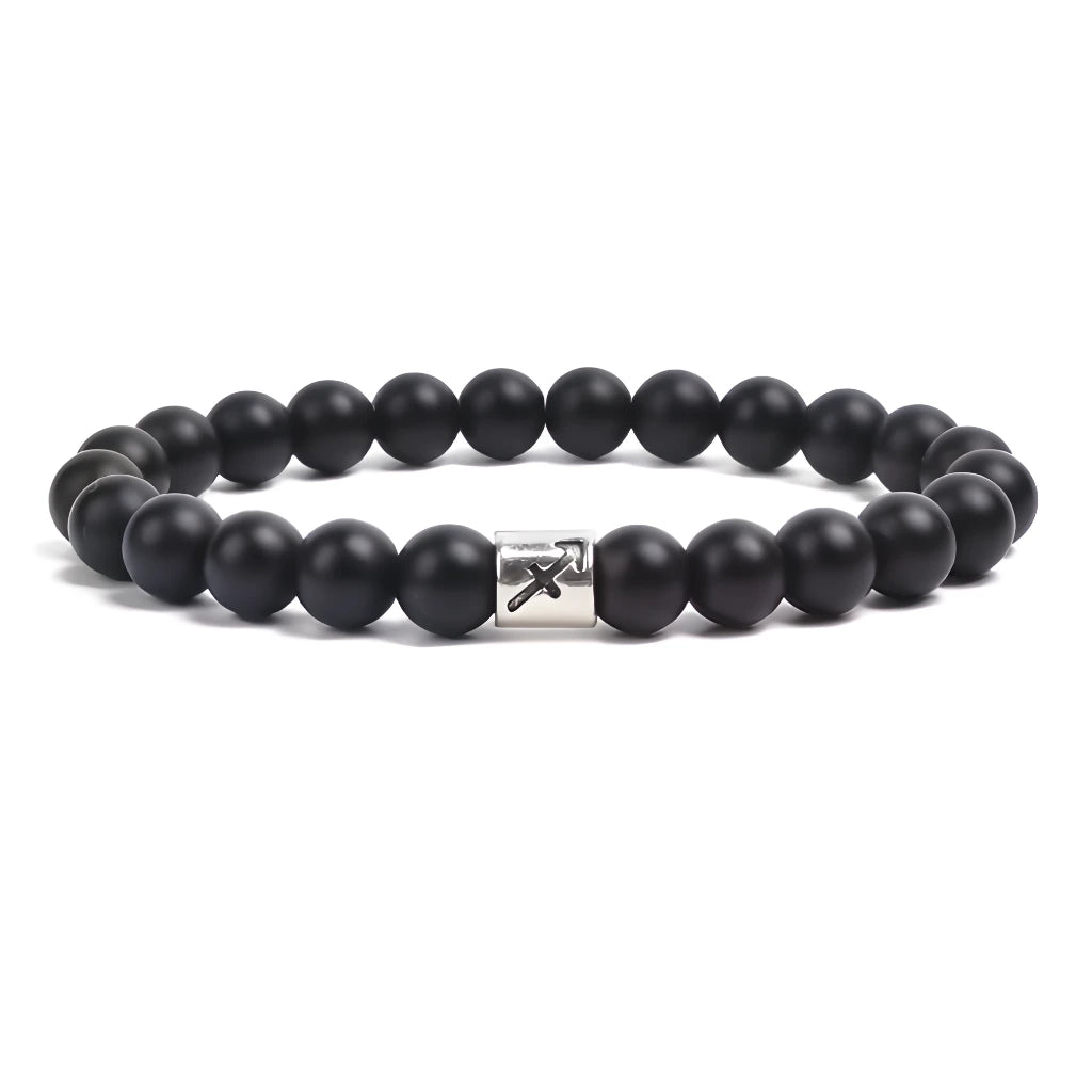 Black beaded bracelet with a metal clasp on a white background