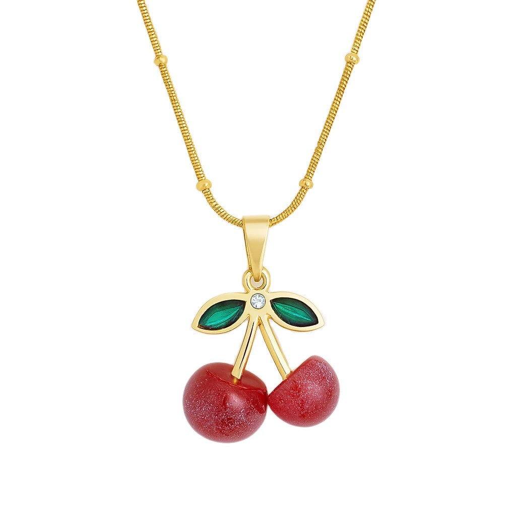 Cherry crystal gold necklace on white background 