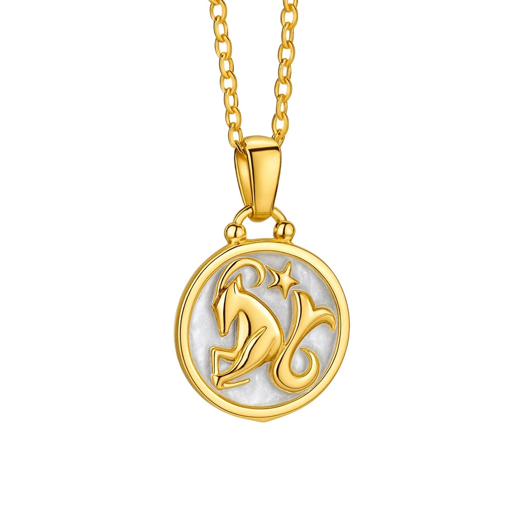 Gold necklace with a circular pendant featuring a design a zodiac design on a white background.