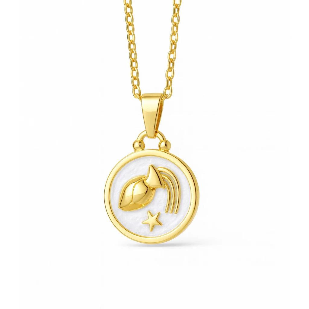 Gold necklace with a circular pendant featuring a zodiac design on a white background